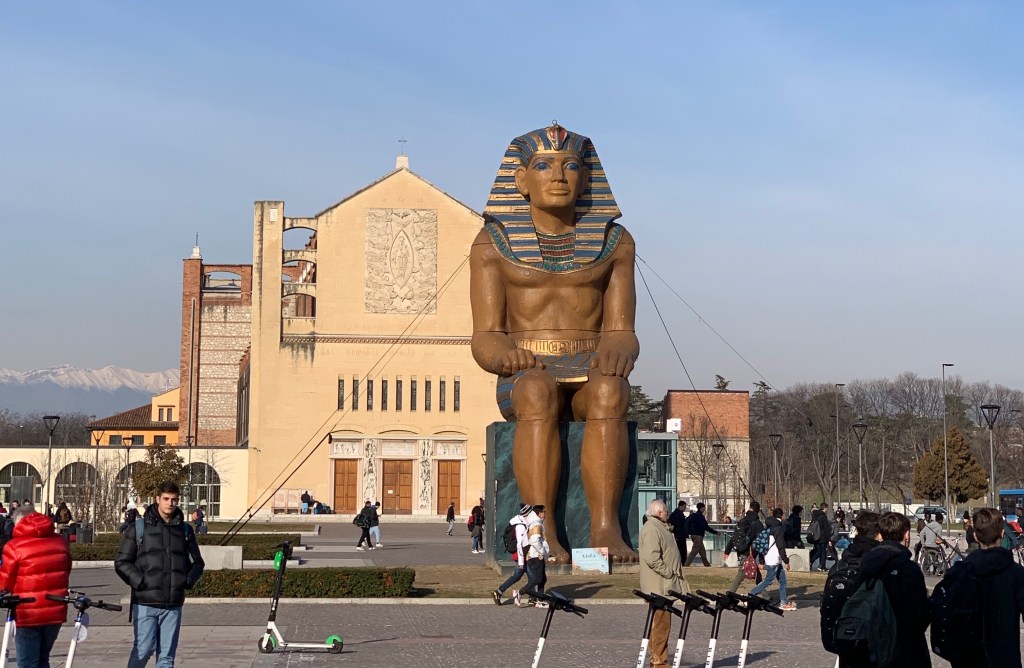 Giant statue of an Egyptian pharaoh, located outside the train station in Verona