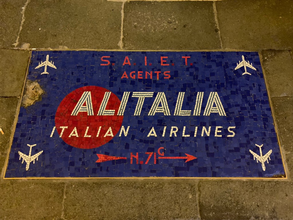 Alitalia airlines mosaic embedded in the street, Venice
