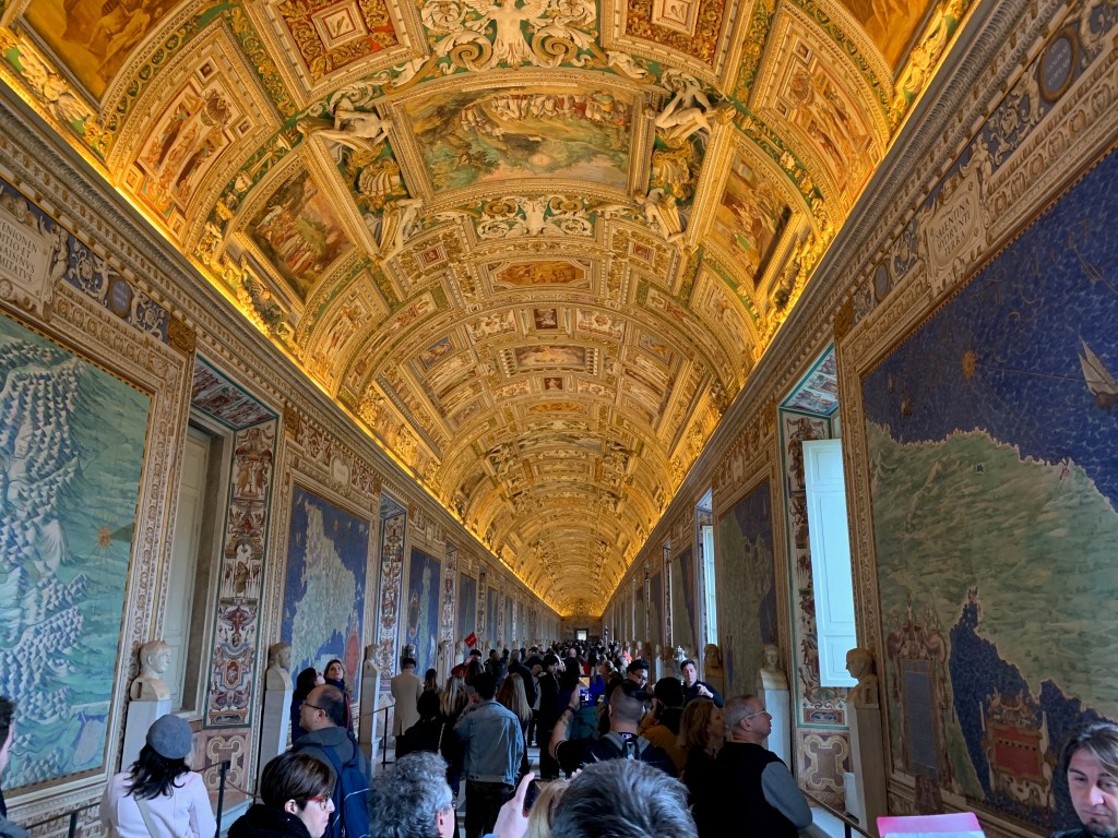 View of the Vatican's Gallery of Maps with tourists