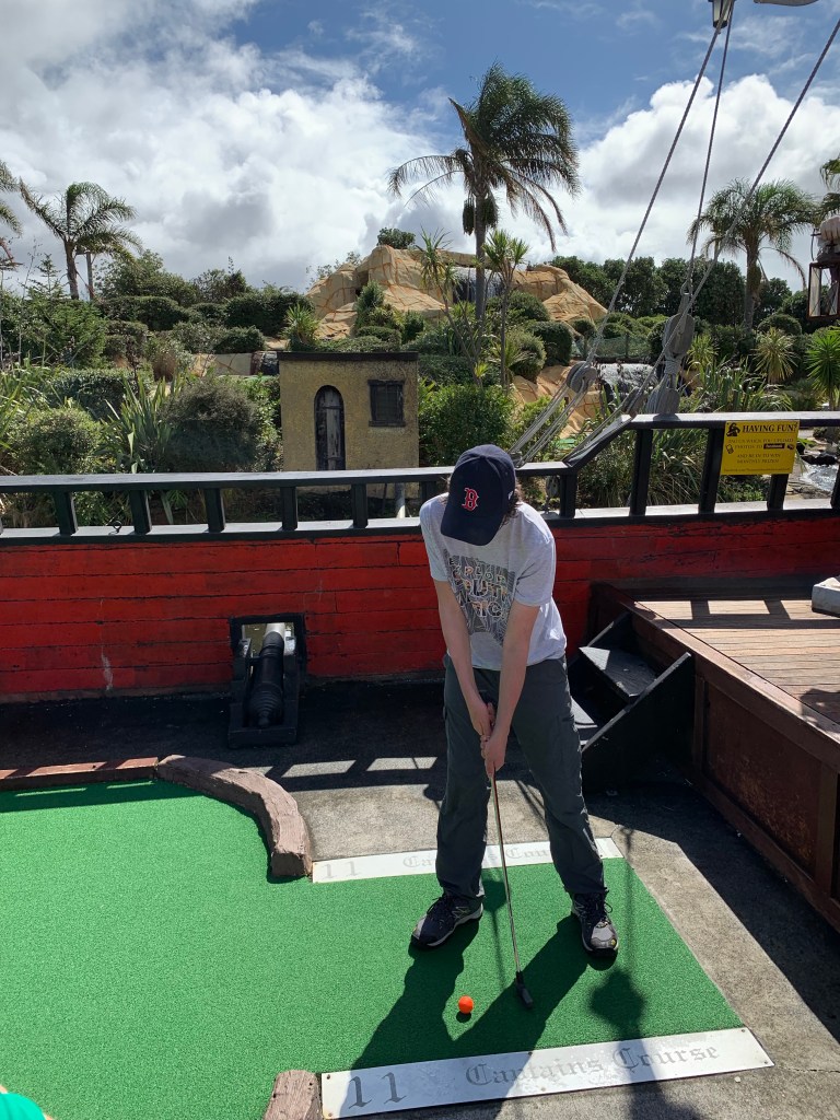 Putting at the Treasure Island mini golf course in Auckland