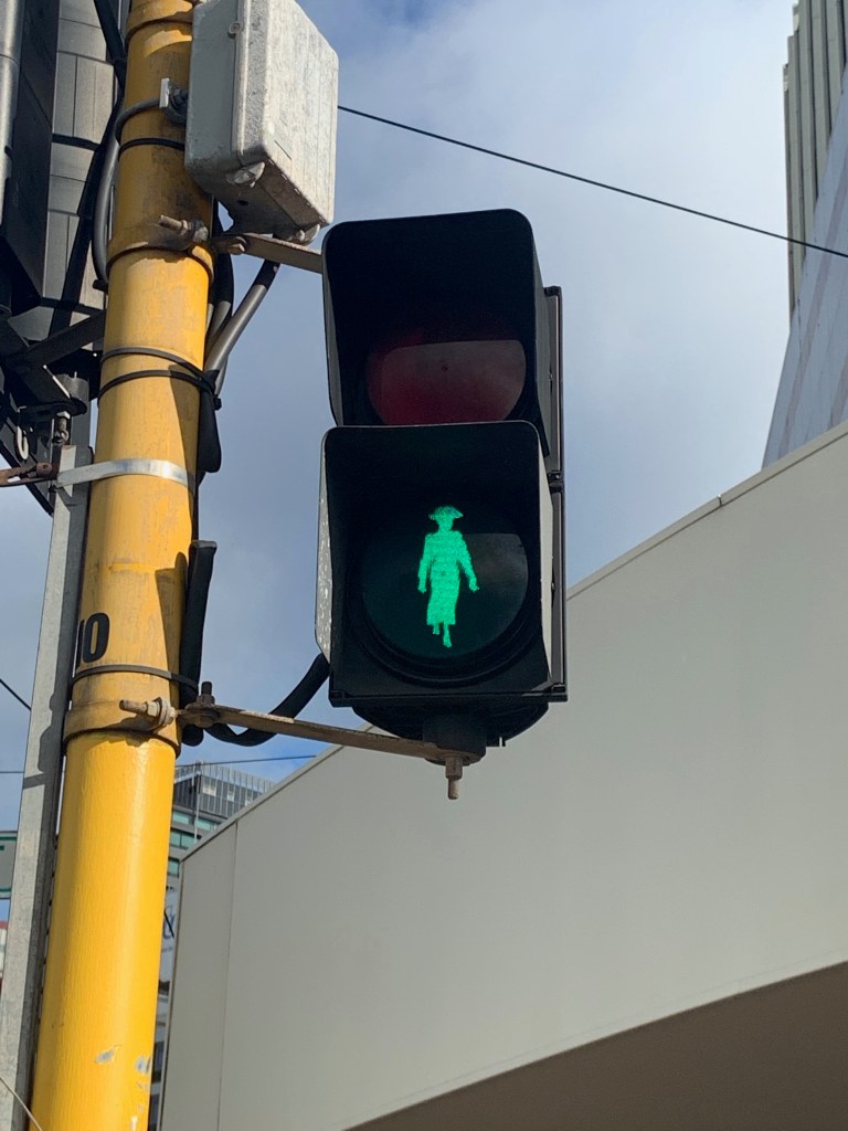 Walk sign in Wellington, with the silhouette of Kate Sheppard